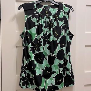 Soft silky floral print sleeveless shirt.